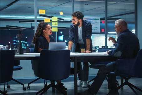 Business Partners Discuss Financial Reports