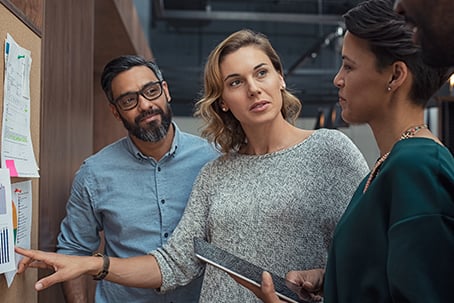 Multiethnic business people discussing charts and graphs